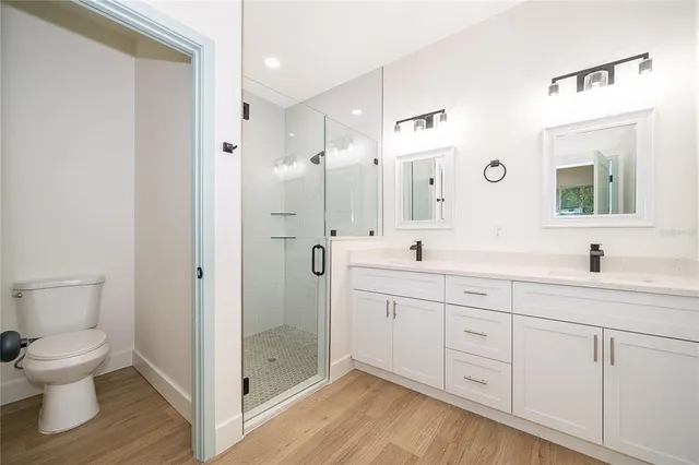 an empty room with a window and a ceiling fan