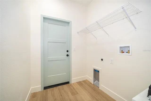 an aerial view of residential houses with outdoor space and street view