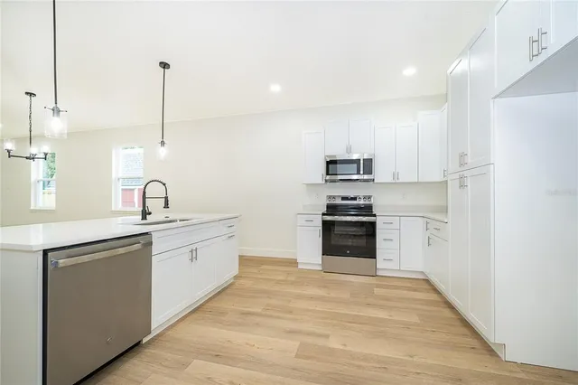 a view of an empty room with a window