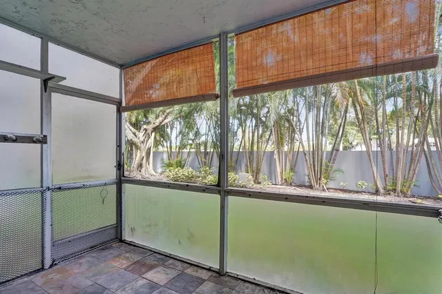 a view of a room with a large window