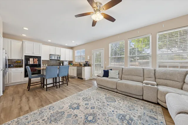 a living room with furniture and a large window