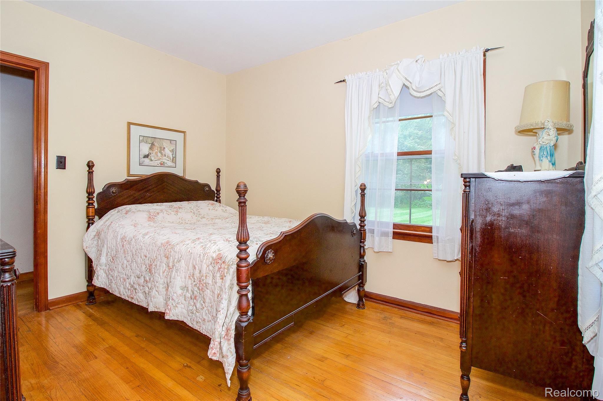 4270 West Commerce Road Milford, MI 48380 - Photo 19 of 30 Bedroom 2 - Both bedrooms have hardwood flooring