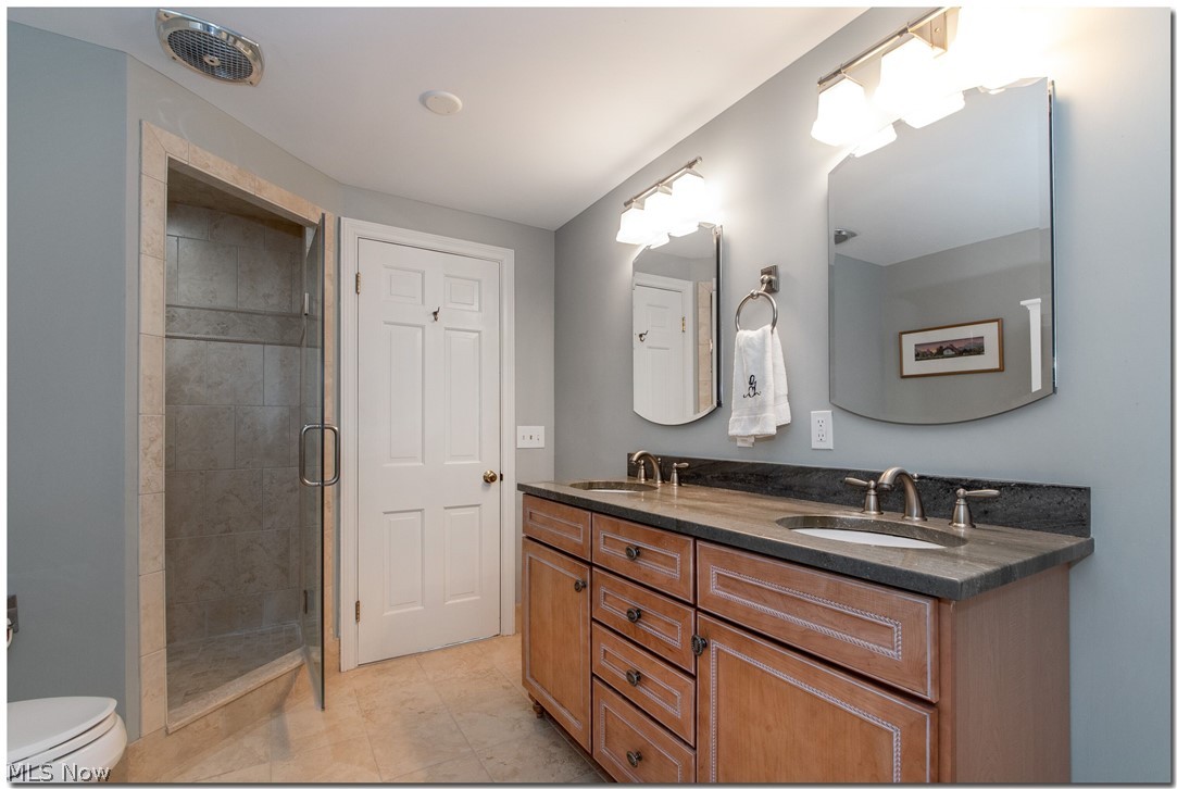33955 Old Kinsman Road Hunting Valley, OH 44022 - Photo 24 of 35 The master bath was nicely renovated to incorporate a new shower and double vanity.