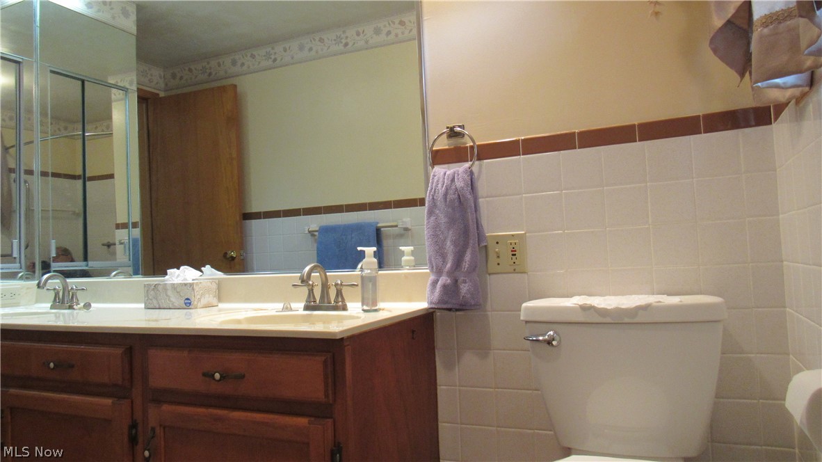 6841 Navarre Road Southwest Massillon, OH 44646 - Photo 16 of 50 ANother view of vanity and toilet area