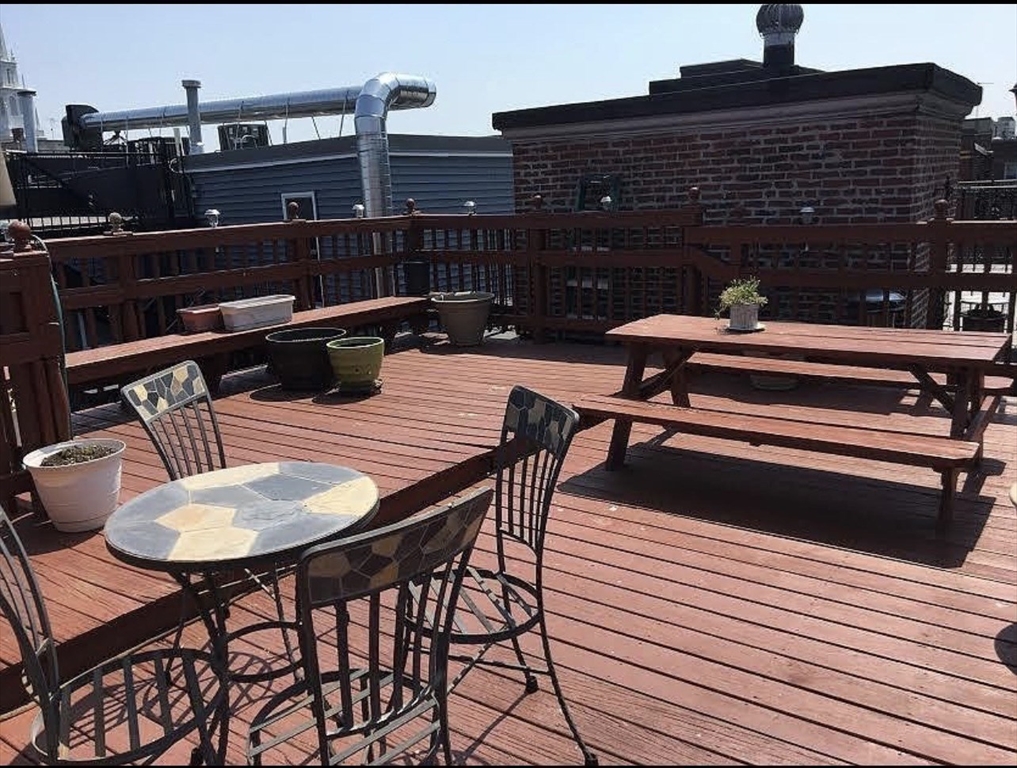 69 North Margin Street, Unit B Boston, MA 02113 - Photo 14 of 15 a balcony with table and chairs