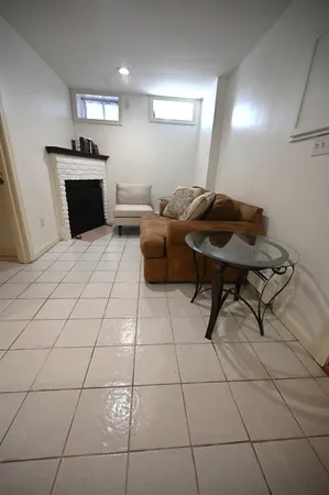 a living room with a black white checkered floor