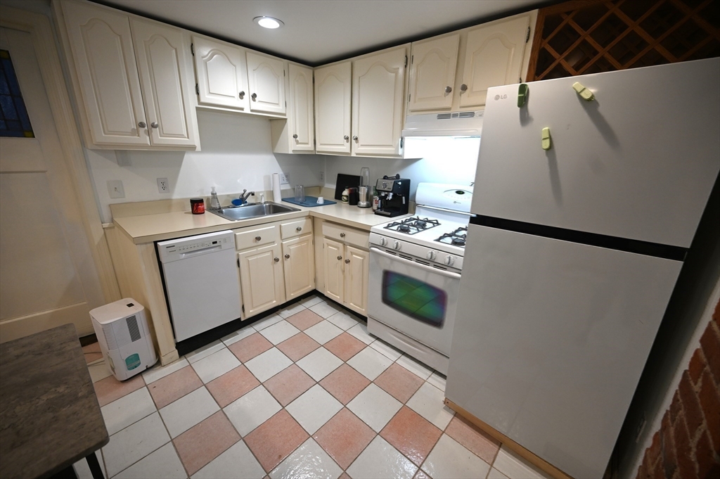 69 North Margin Street, Unit B Boston, MA 02113 - Photo 5 of 15 a kitchen with a cabinets and white appliances
