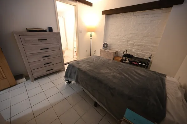 a bedroom with a bed and a cabinets