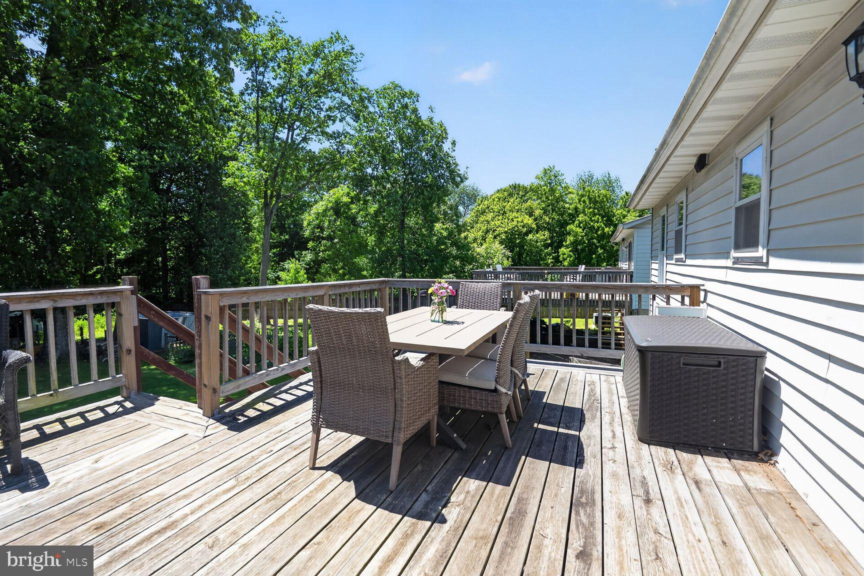 847 Streaker Road Sykesville, MD 21784 - Photo 12 of 41 Large deck with view of flat/fenced backyard.