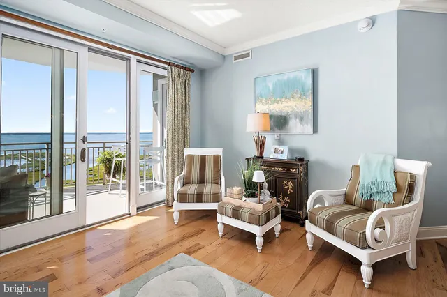 a kitchen with a sink cabinets and wooden floor