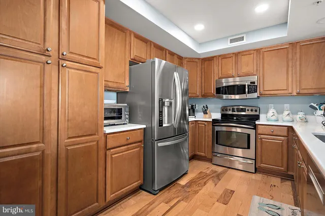 a bathroom with a sink shower vanity and a mirror