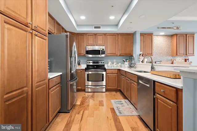 a bedroom with a bed a mirror and a window