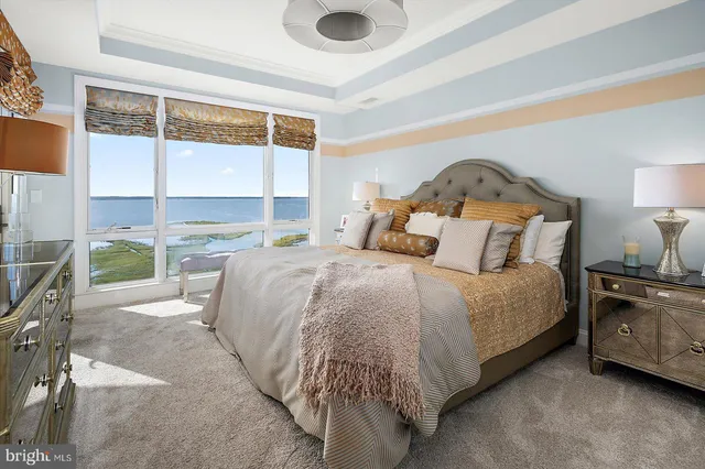 a view of a tall building next to a road