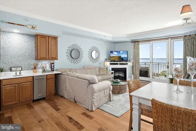 a living room with furniture potted plant and a window