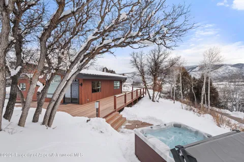 a view of a house with a yard and garage