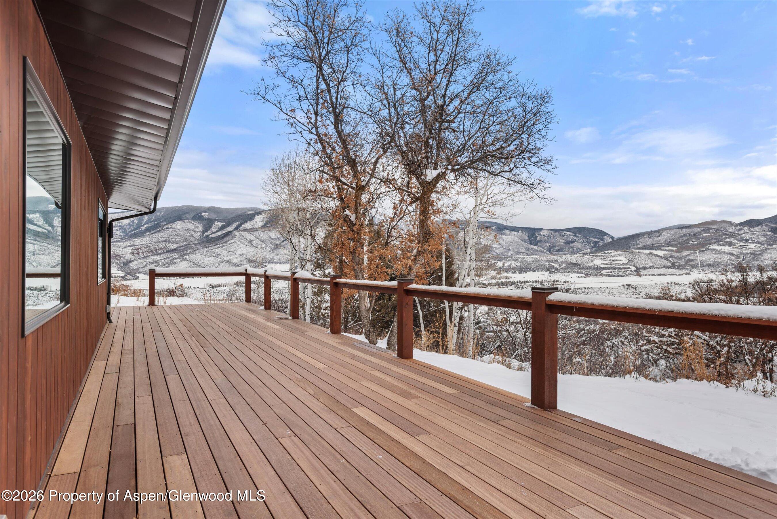 120 Turtle Cove Aspen, CO 81611 - Photo 25 of 25 a view of balcony with wooden floor and fence