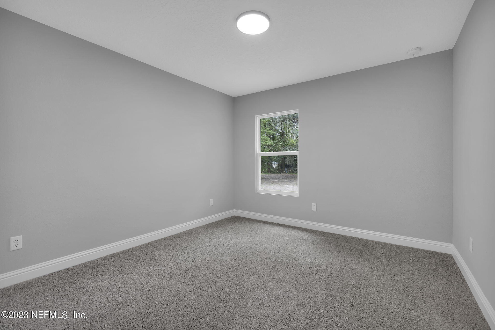 13216 Yellow Bluff Road Jacksonville, FL 32226 - Photo 14 of 28 an empty room with a window