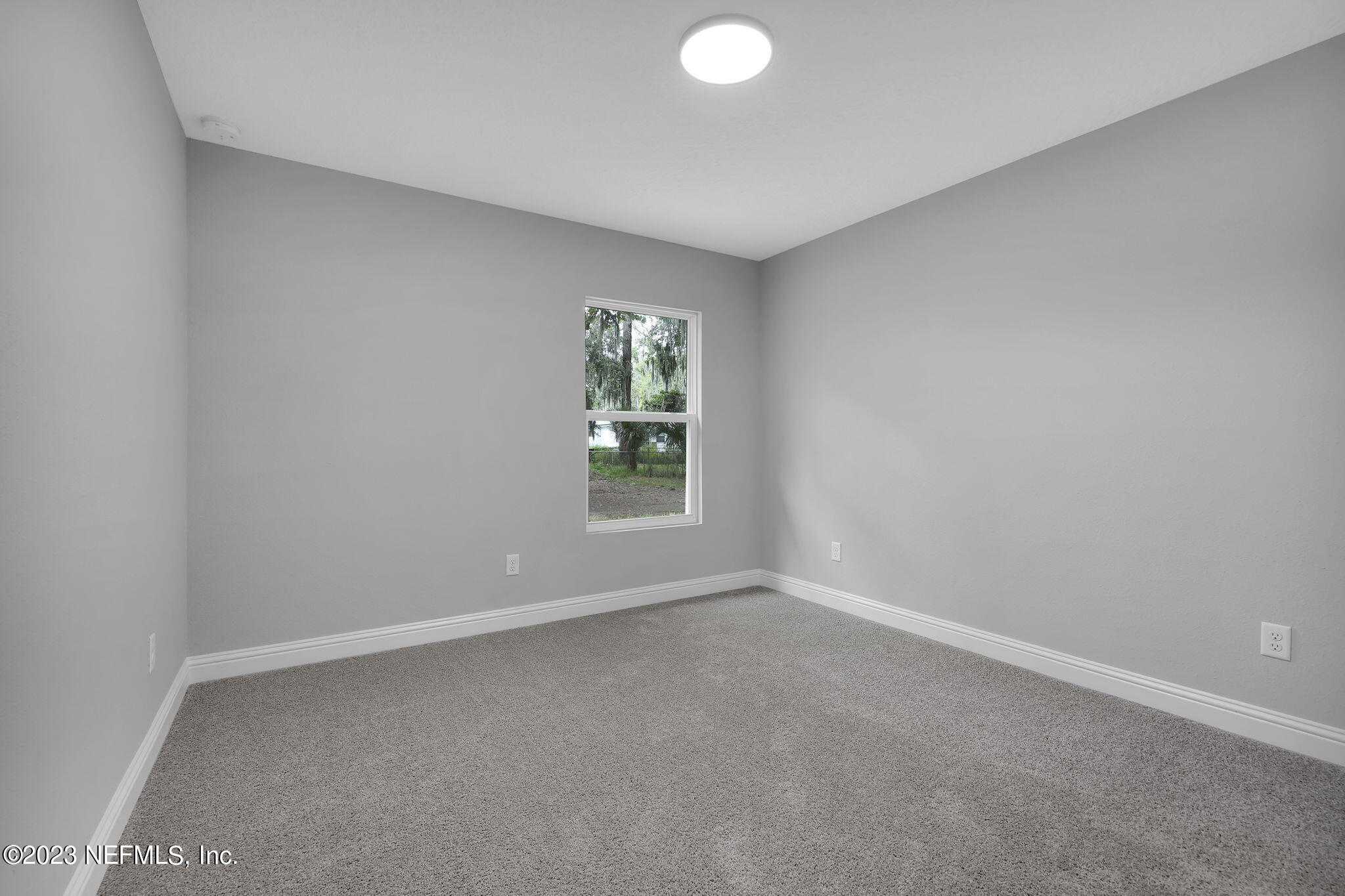 13216 Yellow Bluff Road Jacksonville, FL 32226 - Photo 15 of 28 an empty room with windows