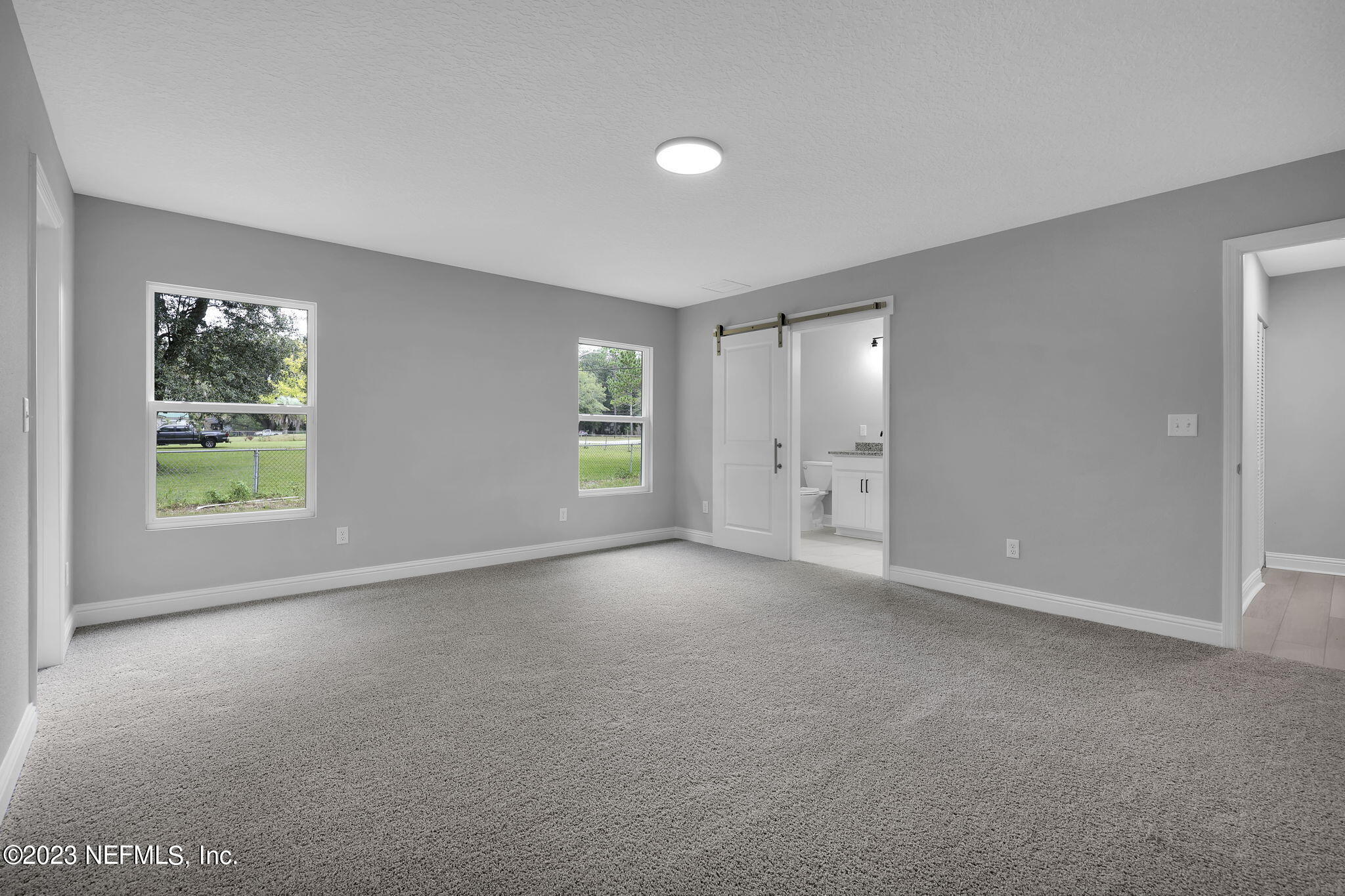 13216 Yellow Bluff Road Jacksonville, FL 32226 - Photo 20 of 28 an empty room with windows and closet