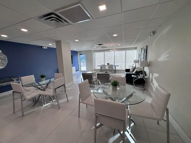 a room with gym equipment and a large window