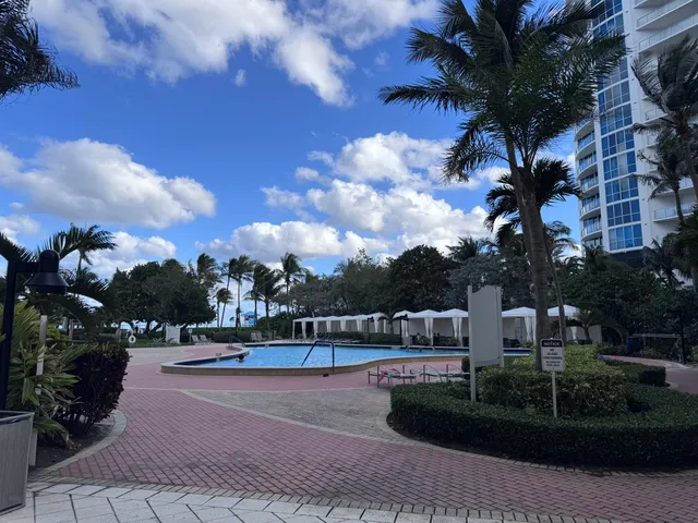 a view of a tables and chairs in a patio