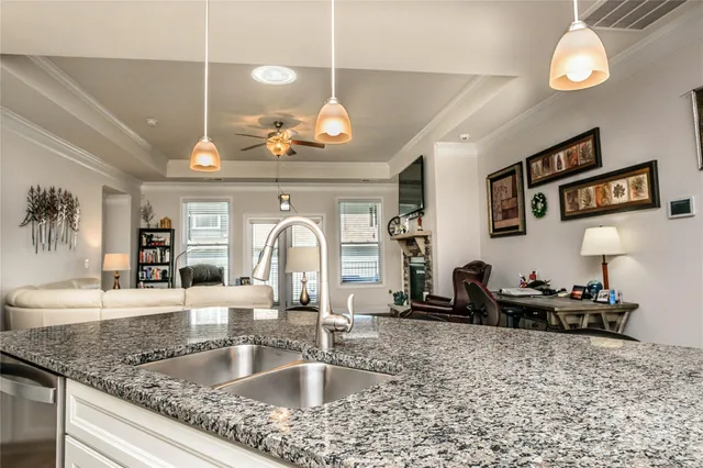 a kitchen with a refrigerator a sink and a counter space
