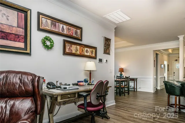 a view of a livingroom with furniture and wooden floor