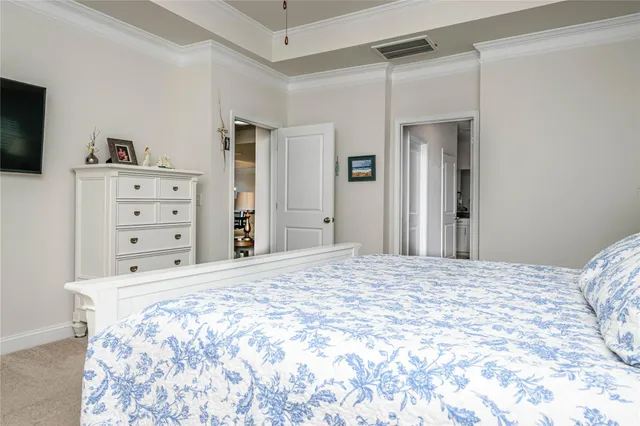 a bedroom with a bed and a television