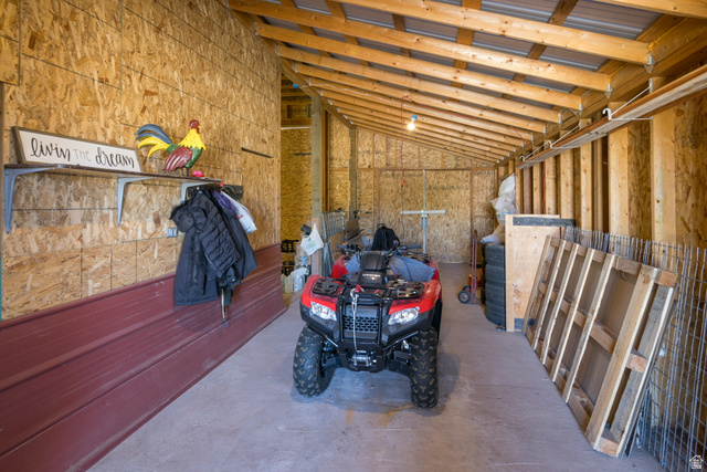 684 Blue Mountain Ridge Monticello, UT 84535 - Photo 21 of 71 Misc room featuring lofted ceiling, a garage, and concrete flooring