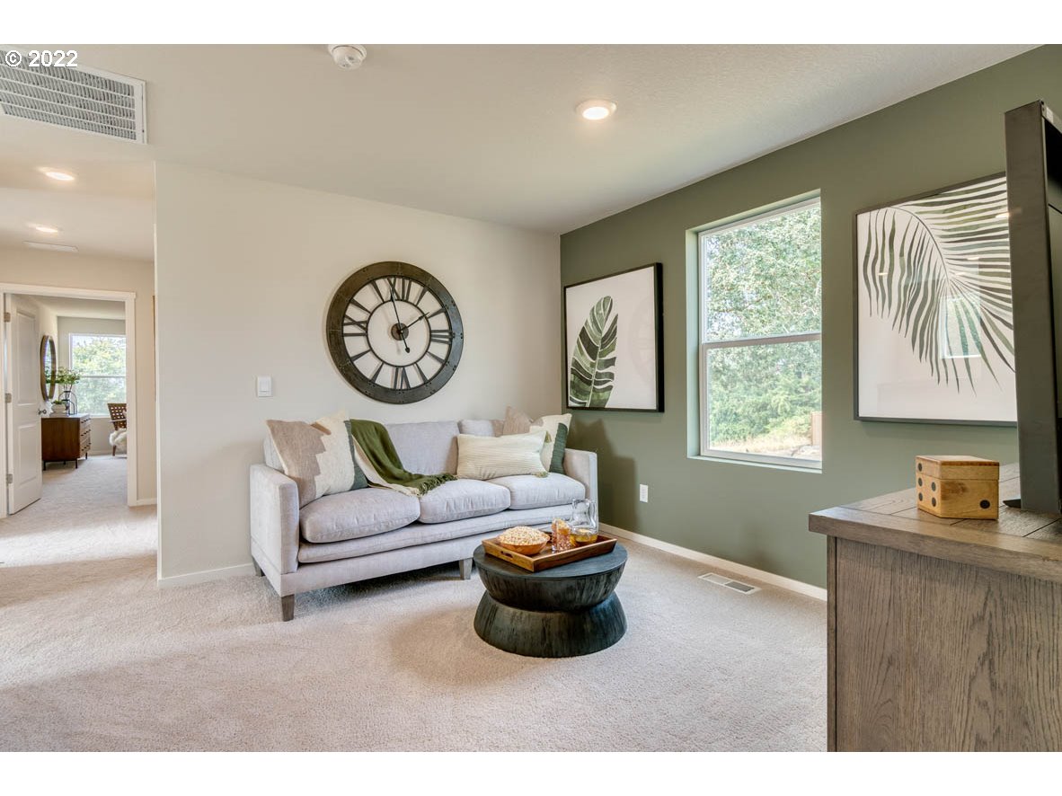911 Northwest 174th Street Ridgefield, WA 98642 - Photo 9 of 19 a living room with furniture and a large window