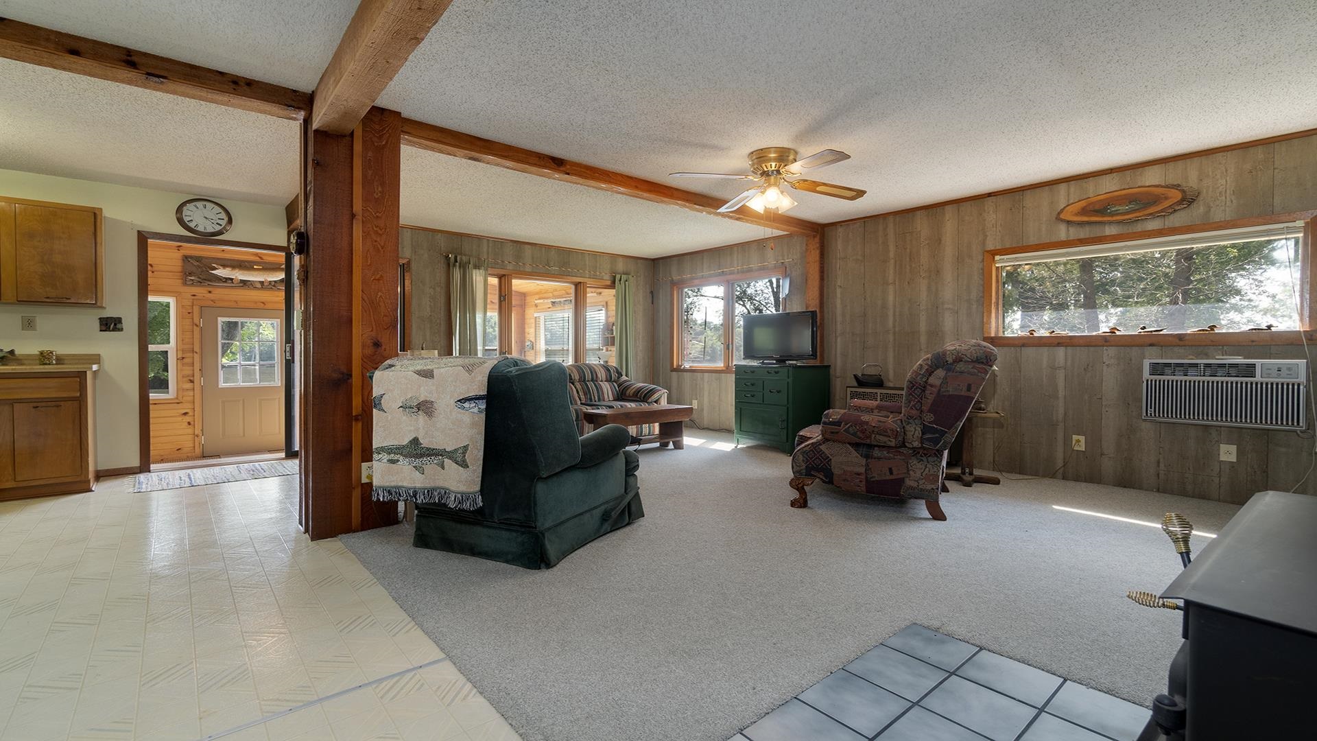 2859 South Brooks Island Road Oregon, IL 61061 - Photo 2 of 39 a living room with furniture and a flat screen tv
