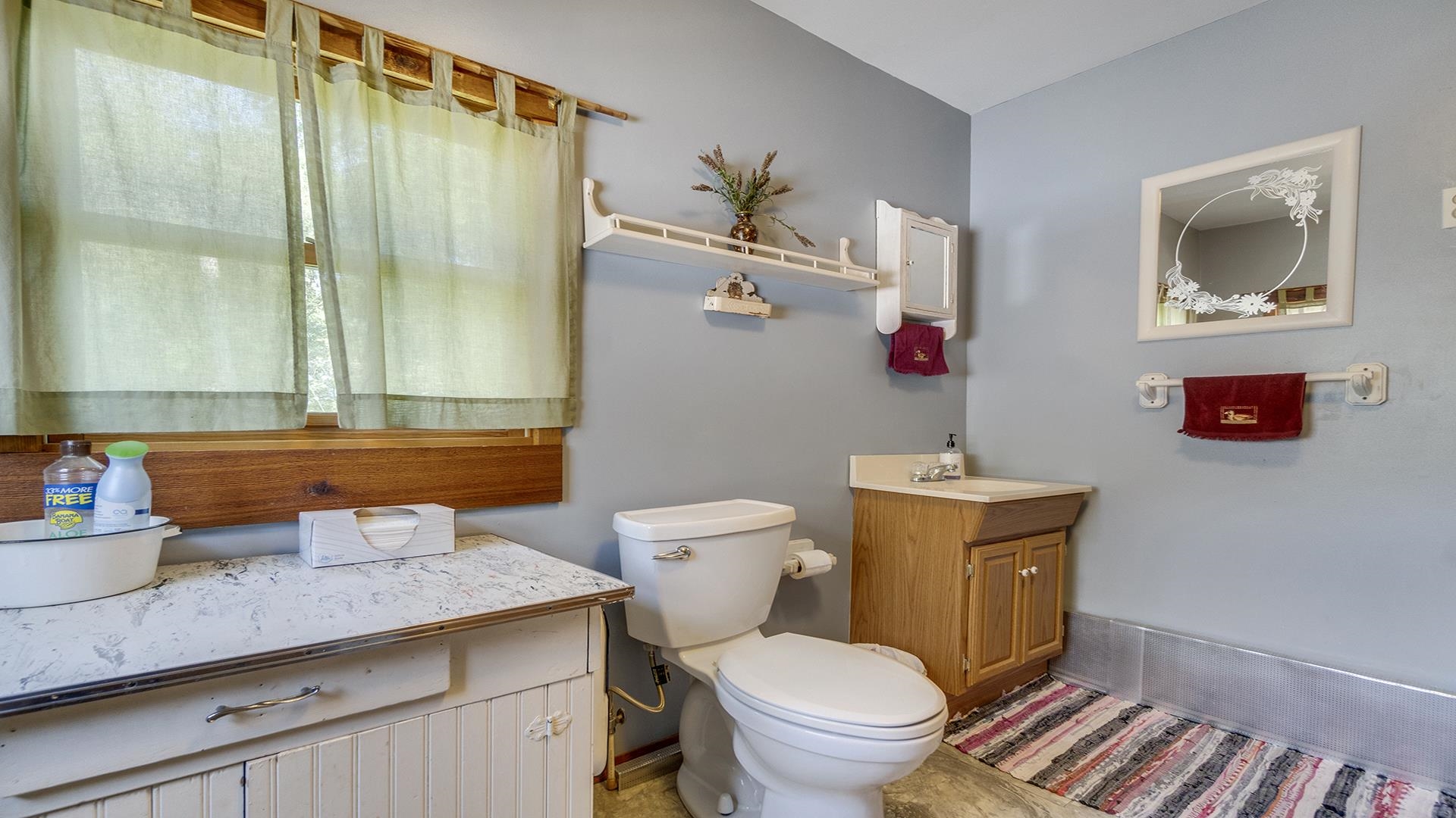 2859 South Brooks Island Road Oregon, IL 61061 - Photo 24 of 39 a bathroom with a granite countertop sink mirror vanity and toilet