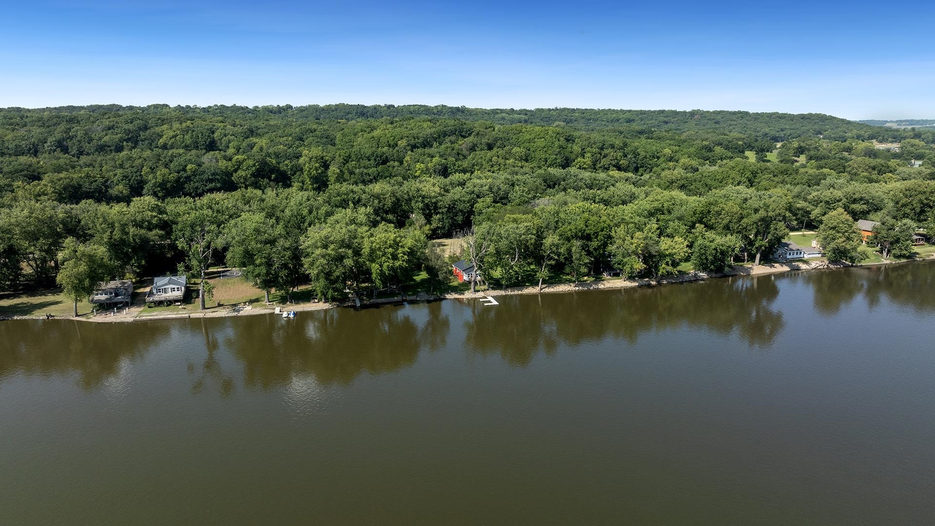 2859 South Brooks Island Road Oregon, IL 61061 - Photo 35 of 39 a view of a lake with trees in the background