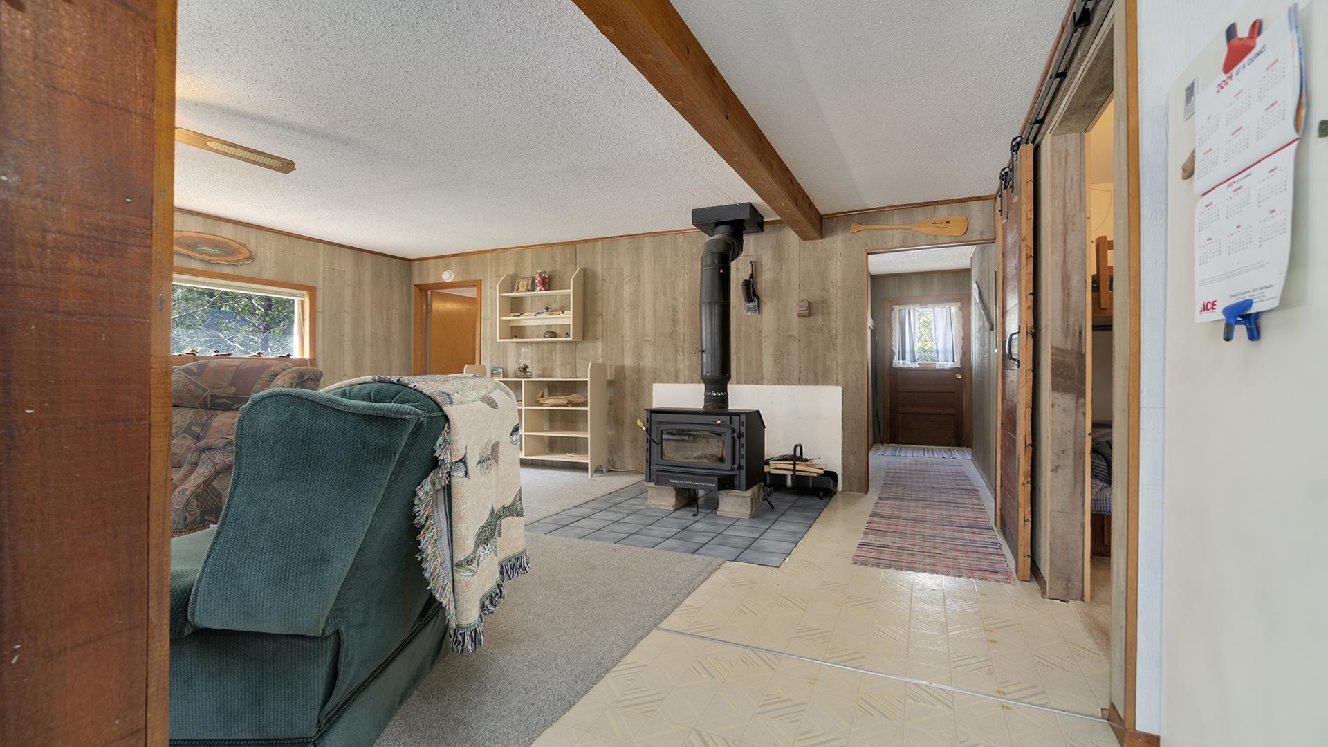 2859 South Brooks Island Road Oregon, IL 61061 - Photo 7 of 39 a living room with furniture and a gate
