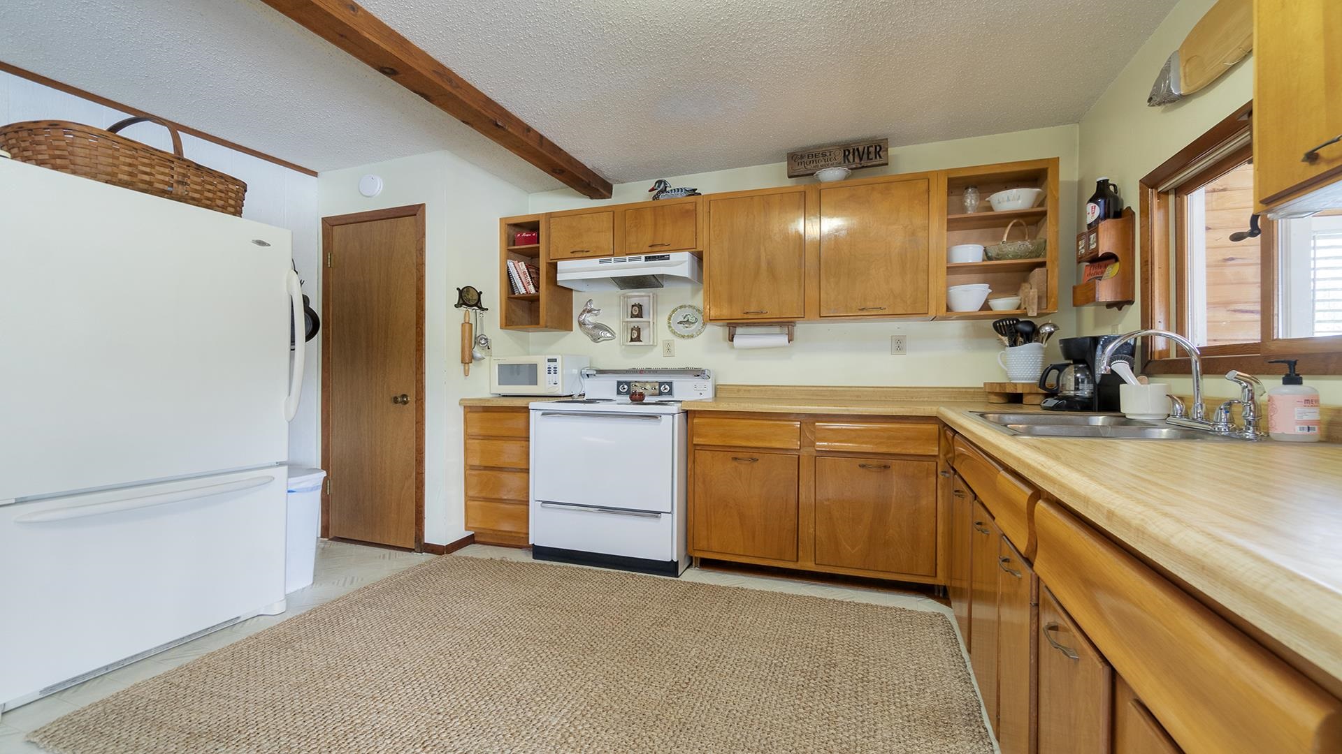 2859 South Brooks Island Road Oregon, IL 61061 - Photo 8 of 39 a kitchen with a sink cabinets and appliances