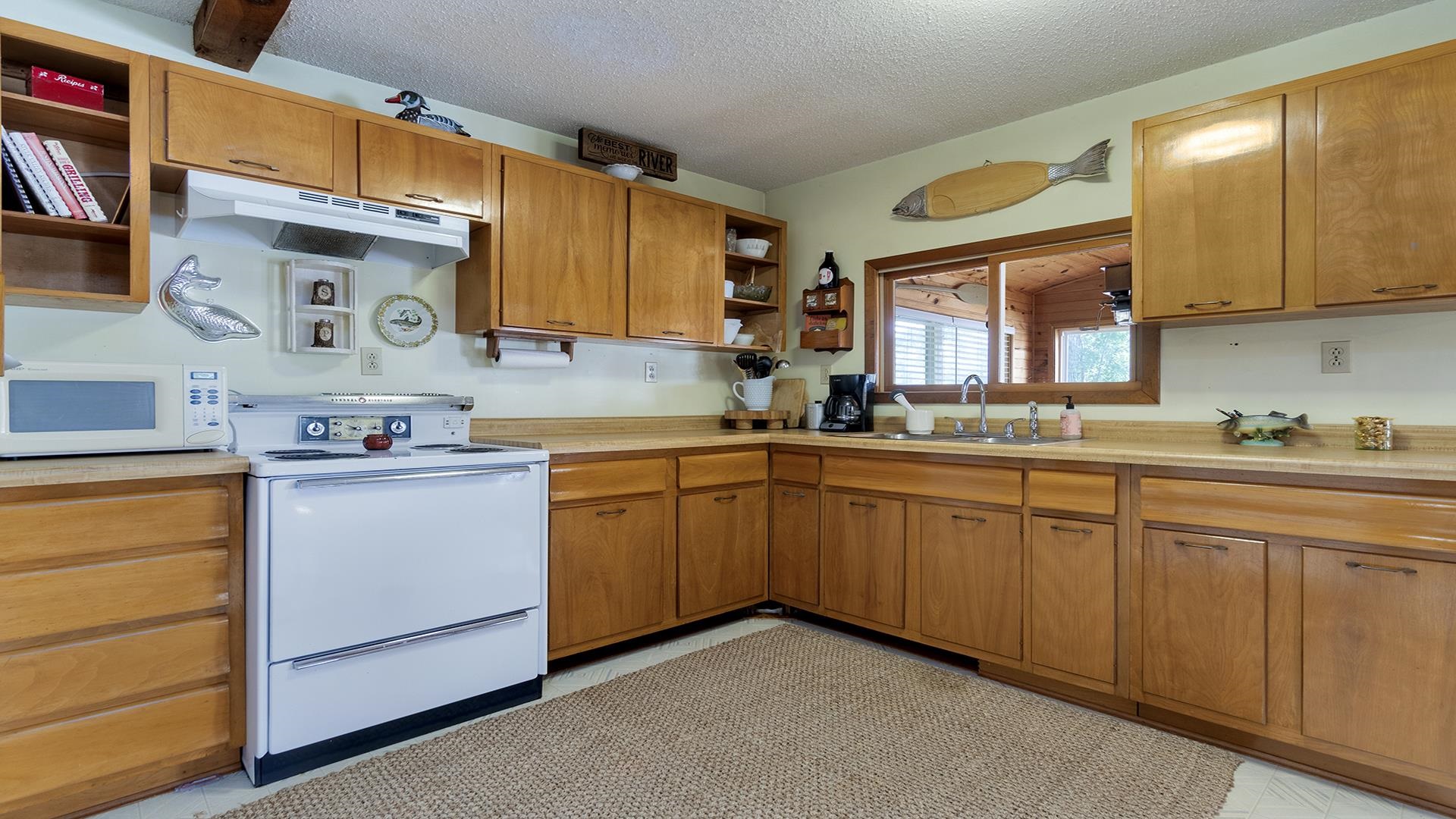 2859 South Brooks Island Road Oregon, IL 61061 - Photo 9 of 39 a kitchen with a sink cabinets and window