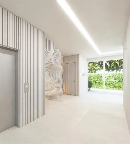 a view of a livingroom with a floor to ceiling window and an entryway