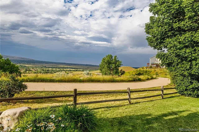 a small garden view with a seating space