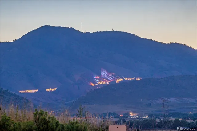 a view of an ocean and a mountain