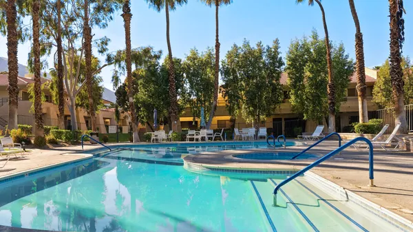 a view of a swimming pool with a patio