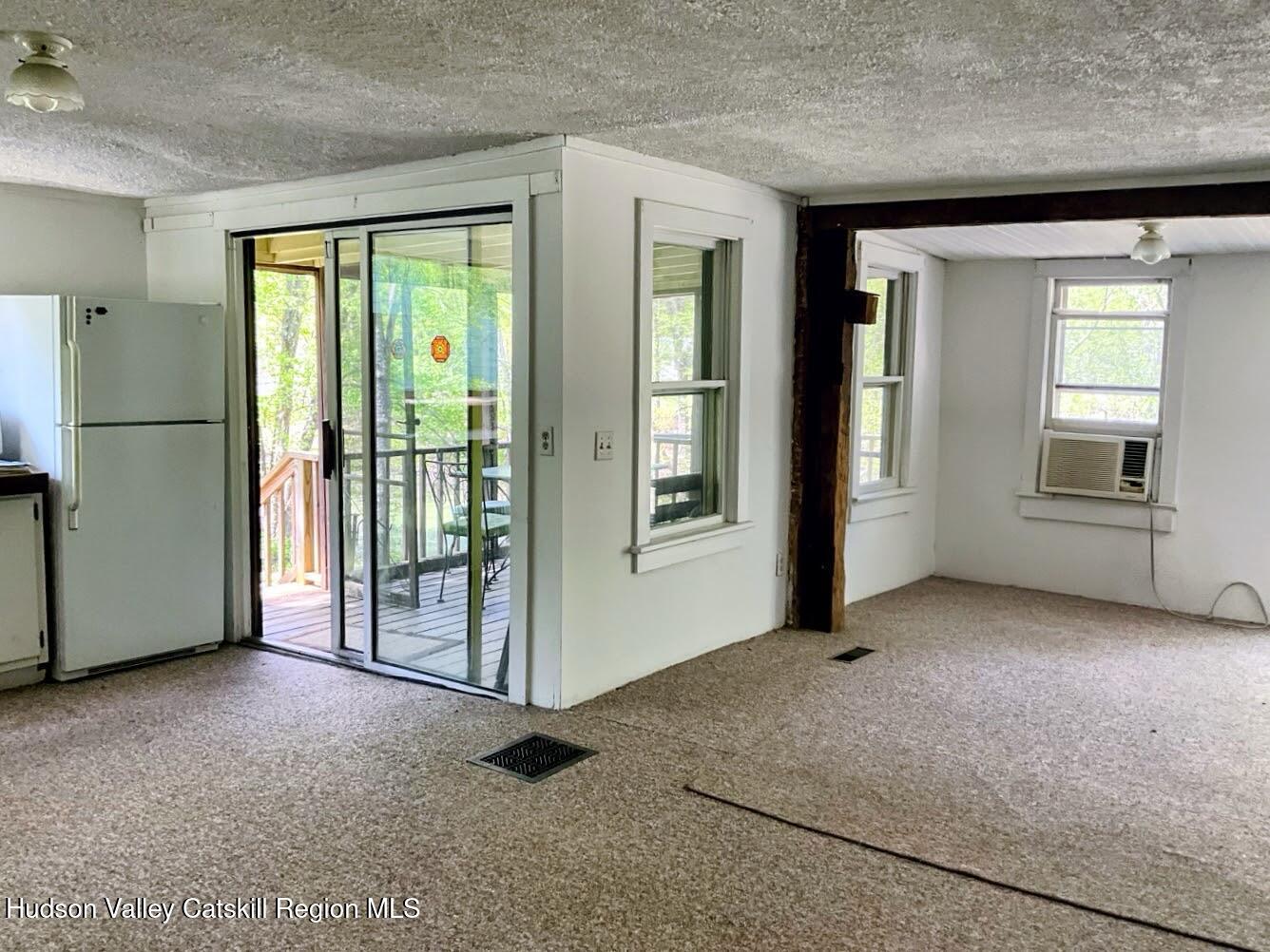 707 Springtown Road Tillson, NY 12486 - Photo 14 of 46 an empty room with windows