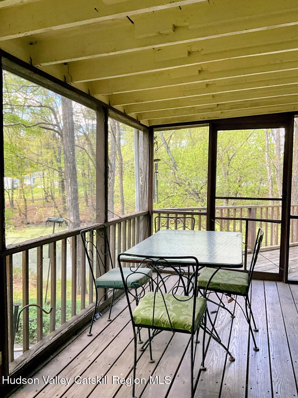 707 Springtown Road Tillson, NY 12486 - Photo 15 of 46 a view of a city from a balcony with furniture