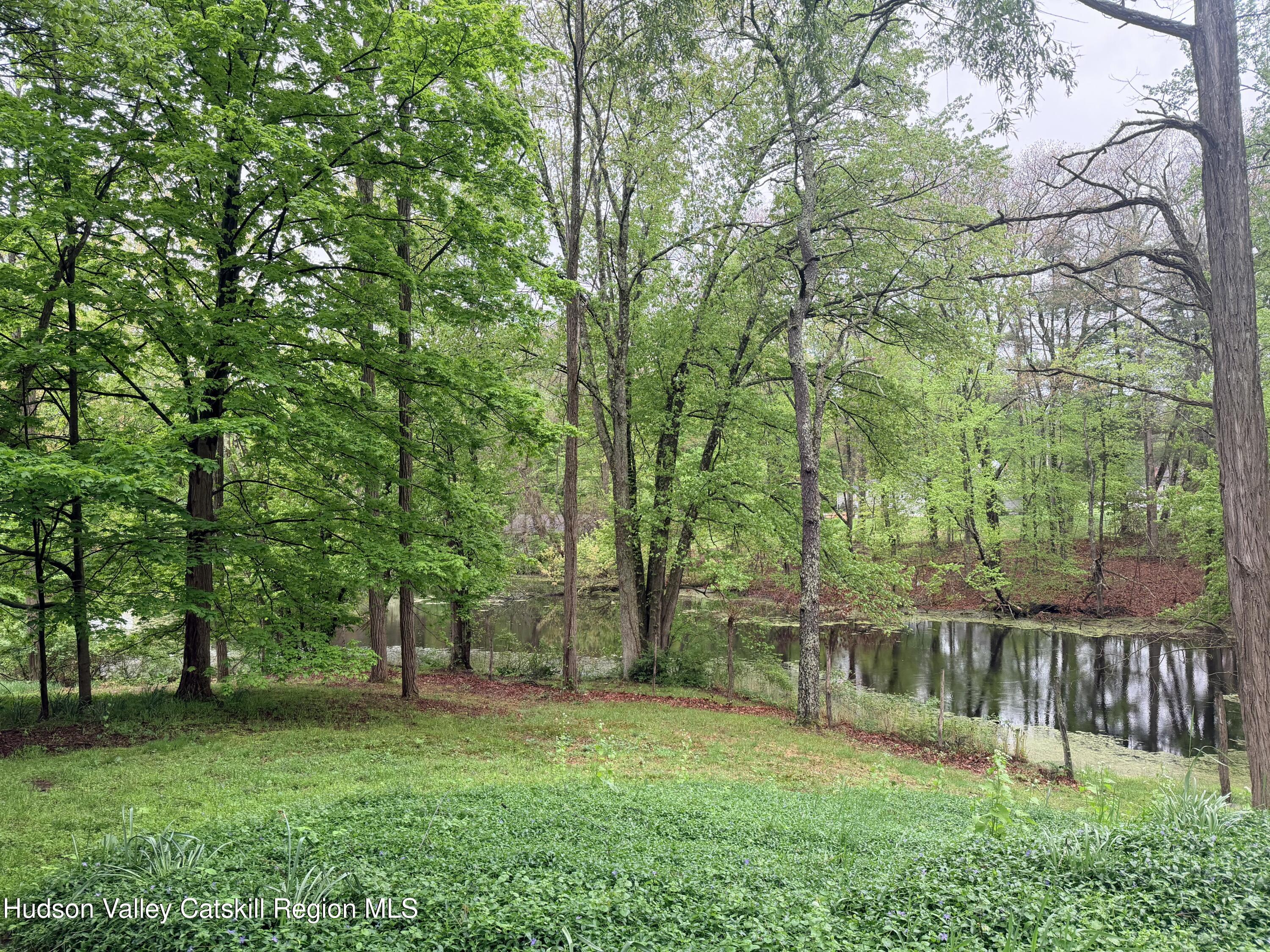 707 Springtown Road Tillson, NY 12486 - Photo 18 of 46 a view of a backyard with a wooden deck