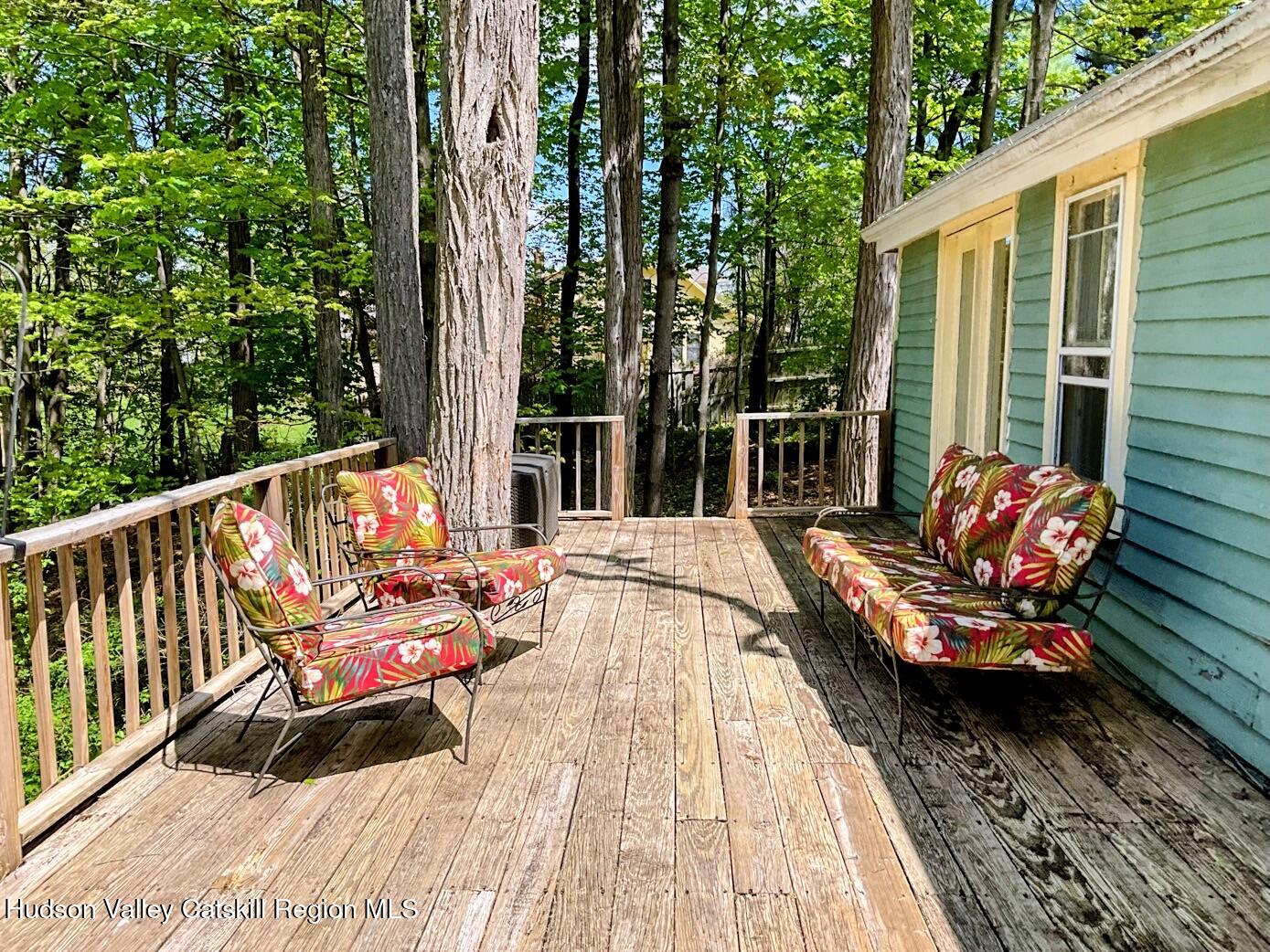707 Springtown Road Tillson, NY 12486 - Photo 20 of 46 a balcony with furniture and wooden floor