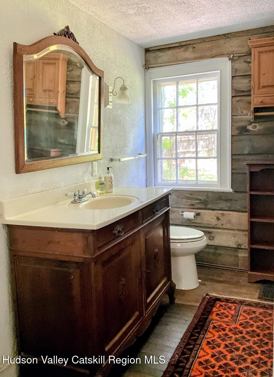 707 Springtown Road Tillson, NY 12486 - Photo 23 of 46 a bathroom with a sink toilet and mirror