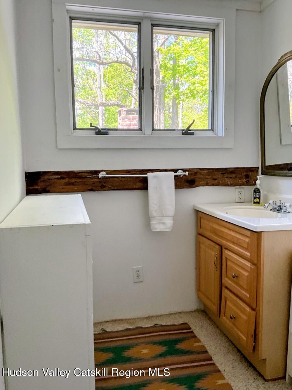 707 Springtown Road Tillson, NY 12486 - Photo 31 of 46 a bathroom with a sink and a mirror