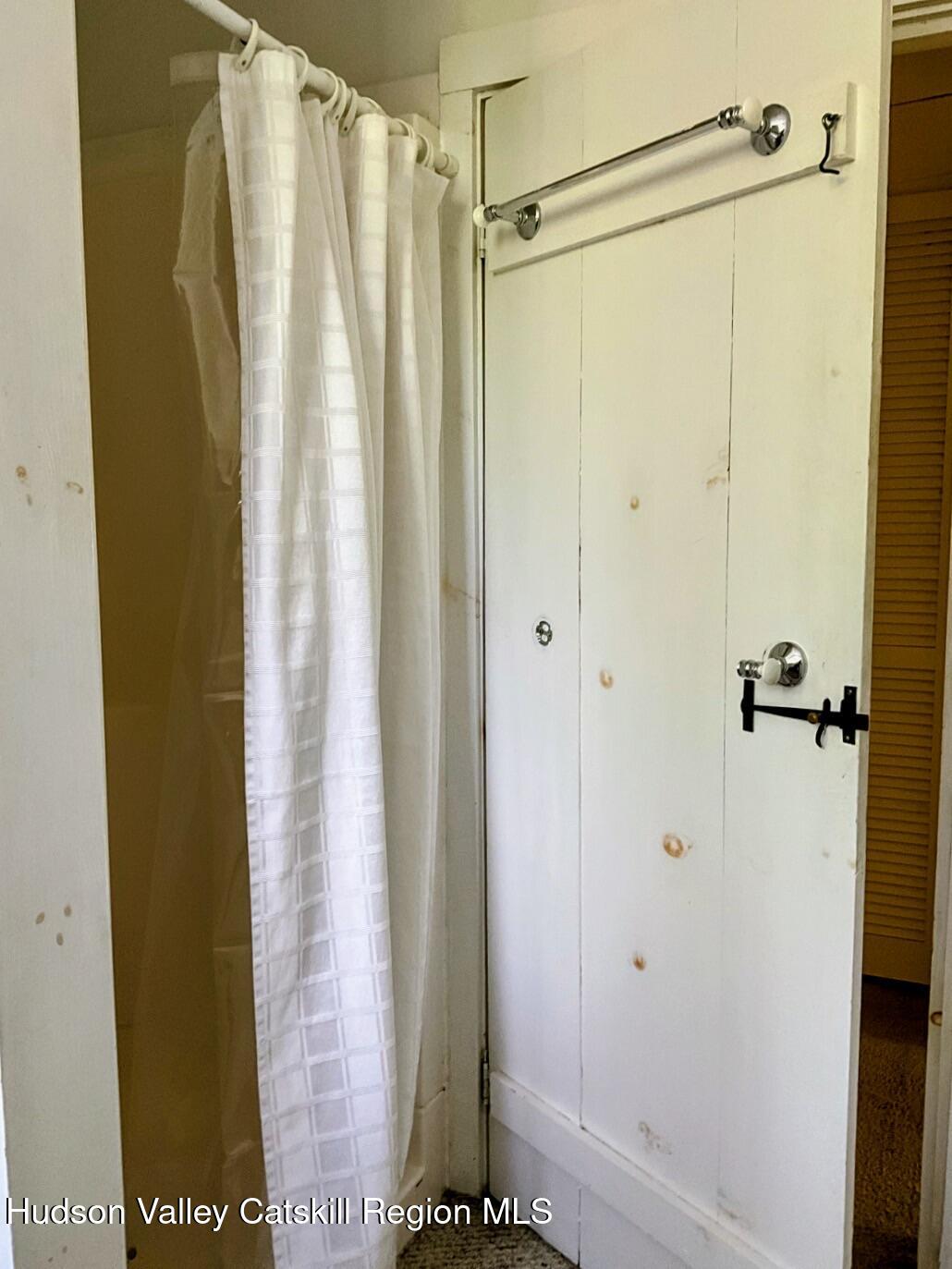 707 Springtown Road Tillson, NY 12486 - Photo 32 of 46 a bathroom with a shower and a glass door
