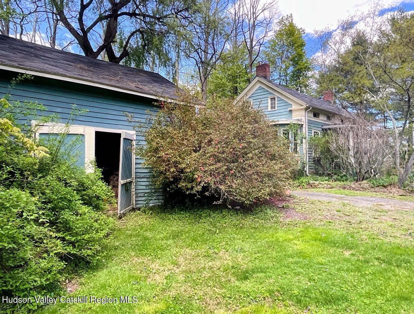 707 Springtown Road Tillson, NY 12486 - Photo 37 of 46 a view of a house with a yard