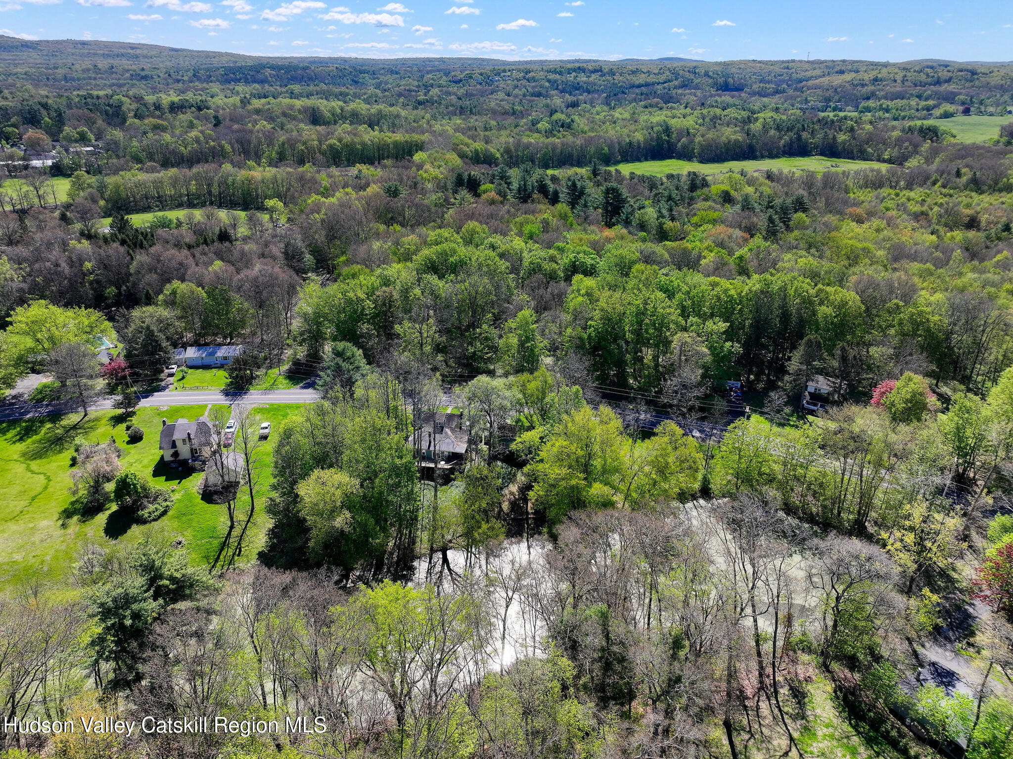 707 Springtown Road Tillson, NY 12486 - Photo 46 of 46 a view of a lush green forest with trees and some houses