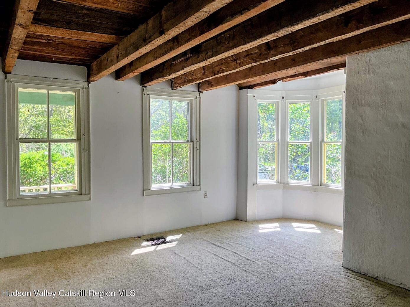 707 Springtown Road Tillson, NY 12486 - Photo 7 of 46 a view of an empty room with a window